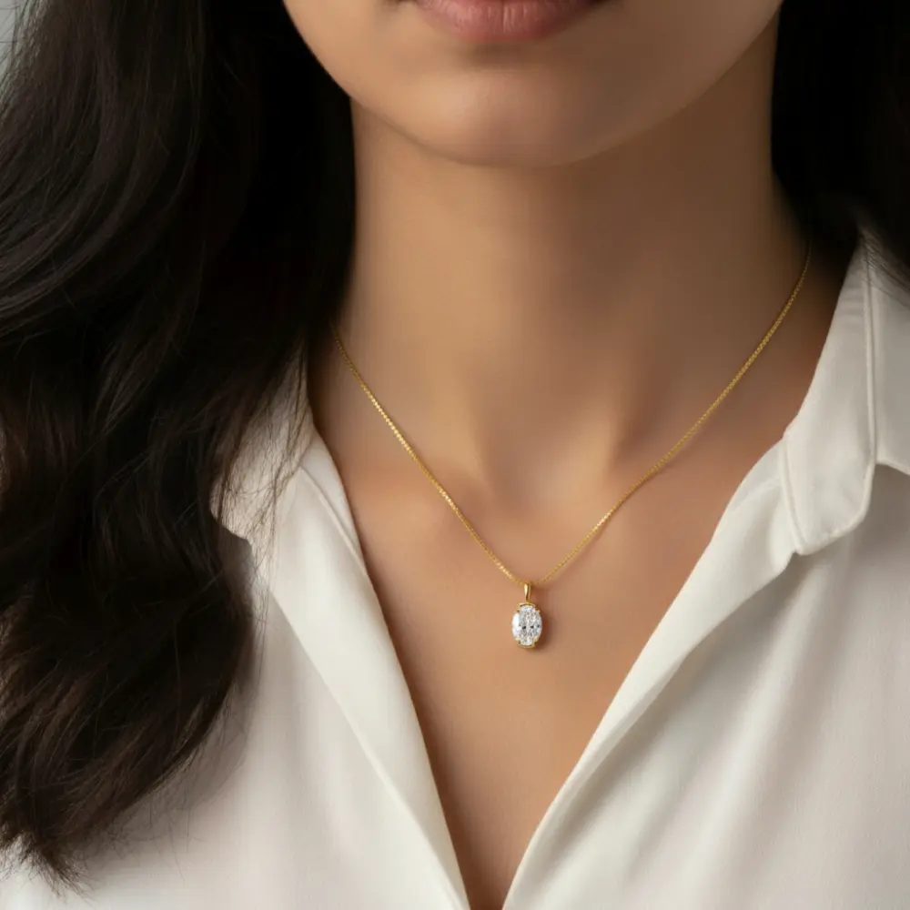 14K Gold Half Bezel Oval Shaped Moissanite Pendant Necklace close up, Adora Fine Jewelry