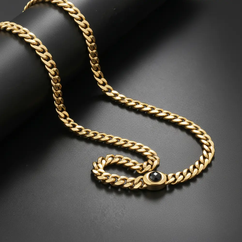 Men’s 18K gold Miami Cuban link chain's box clasp with a black central gemstone styling